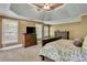 Spacious main bedroom with tray ceiling, plush carpeting and space for a sitting area at 345 Oakwind Pt, Acworth, GA 30101