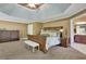 Spacious main bedroom with tray ceiling, plush carpeting and space for a sitting area at 345 Oakwind Pt, Acworth, GA 30101