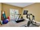 Workout room with treadmill, bike and fitness equipment at 345 Oakwind Pt, Acworth, GA 30101