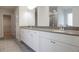 Elegant bathroom with gray countertops, double sinks, and white cabinets at 2256 Cadenza Cir, Dacula, GA 30019
