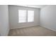 This carpeted bedroom has a large window for lots of natural light at 2256 Cadenza Cir, Dacula, GA 30019