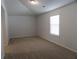 Cozy bedroom featuring neutral walls, carpet, and a bright window with blinds at 2256 Cadenza Cir, Dacula, GA 30019