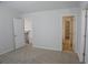 A carpeted bedroom includes a door to the hall and a walk-in closet at 2256 Cadenza Cir, Dacula, GA 30019