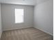 Neutral bedroom featuring natural light from the window and plush carpeting at 2256 Cadenza Cir, Dacula, GA 30019