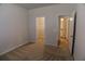 Bedroom showcasing walk-in closet and adjacent shelving closet at 2256 Cadenza Cir, Dacula, GA 30019