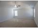 Spacious carpeted bedroom featuring large windows and neutral walls at 2256 Cadenza Cir, Dacula, GA 30019