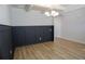 Elegant dining room featuring coffered ceiling and modern wainscoting at 2256 Cadenza Cir, Dacula, GA 30019