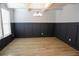 Dining room with coffered ceilings, wainscoting, and wood flooring at 2256 Cadenza Cir, Dacula, GA 30019