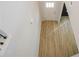 Bright entryway featuring wood-look flooring and a white front door at 2256 Cadenza Cir, Dacula, GA 30019