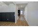 Inviting entryway featuring sleek wood flooring and stylish black wainscoting at 2256 Cadenza Cir, Dacula, GA 30019