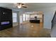 Living room with fireplace and open access to kitchen with a dark island at 2256 Cadenza Cir, Dacula, GA 30019