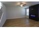 Bright living room with wood floors and a modern fireplace at 2256 Cadenza Cir, Dacula, GA 30019