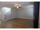Spacious living room with wood floors, staircase, and modern fireplace at 2256 Cadenza Cir, Dacula, GA 30019