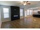 Open-concept living room with a fireplace and direct access to the kitchen at 2256 Cadenza Cir, Dacula, GA 30019