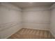 Organized walk-in closet with carpet and wire shelving, maximizing storage space at 2256 Cadenza Cir, Dacula, GA 30019