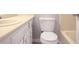 Bright bathroom featuring a vanity, sink, toilet, and bathtub at 669 Hunting Creek Se Ln, Conyers, GA 30013