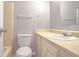 Well-maintained bathroom featuring a white toilet and vanity with classic chrome finishes at 669 Hunting Creek Se Ln, Conyers, GA 30013