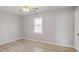 Bright, airy bedroom features a modern ceiling fan, a window, and new flooring at 669 Hunting Creek Se Ln, Conyers, GA 30013