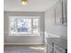 Sun-filled dining area featuring a bay window and white cabinetry with modern hardware at 669 Hunting Creek Se Ln, Conyers, GA 30013
