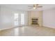 Cozy living room features fireplace with built-in shelving and french doors to the backyard at 669 Hunting Creek Se Ln, Conyers, GA 30013