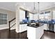 Stylish kitchen with white cabinets, blue backsplash, and stainless steel appliances at 108 Blakemore Se Dr, Smyrna, GA 30080