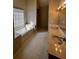 Bright primary bathroom with double sinks, separate tub, and natural light at 136 Hunters Ct, Dallas, GA 30157
