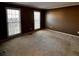 Spacious bedroom with neutral walls, carpet, and windows, offering a serene and relaxing atmosphere at 136 Hunters Ct, Dallas, GA 30157