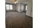 Bright bedroom with a ceiling fan, carpet, and large windows for natural light at 136 Hunters Ct, Dallas, GA 30157