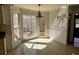 Charming breakfast nook with tiled floors and lots of windows offering great natural light at 136 Hunters Ct, Dallas, GA 30157