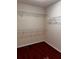 Walk-in closet with laminate floors and wire shelving at 136 Hunters Ct, Dallas, GA 30157