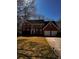 Charming two-story brick home with a well-manicured lawn and a two-car garage at 136 Hunters Ct, Dallas, GA 30157