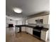 Well-equipped kitchen with granite countertops, stainless steel appliances, and ample cabinet space at 136 Hunters Ct, Dallas, GA 30157