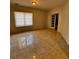 Cozy living room featuring tile floors, a window, and an open doorway at 136 Hunters Ct, Dallas, GA 30157