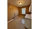 Functional room with tiled floors, single window, overhead lighting, and storage cabinets at 136 Hunters Ct, Dallas, GA 30157