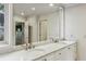This bright, updated bathroom offers double sinks and marble countertops at 17 Blackland Rd, Atlanta, GA 30342