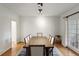 The dining area has a view out to the backyard, a wooden table, and seating for eight at 17 Blackland Rd, Atlanta, GA 30342