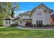 Beautiful home with manicured lawn, lush landscaping, and a classic white facade under a bright blue sky at 17 Blackland Rd, Atlanta, GA 30342