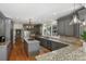Spacious kitchen boasts gray cabinets, granite countertops, stainless steel appliances, and hardwood floors at 17 Blackland Rd, Atlanta, GA 30342