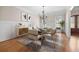 Elegant dining room featuring modern decor, wainscoting, and a glass-top table set for eight at 209 Windsor Green Ct, Canton, GA 30115