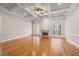 Bright living room with coffered ceiling, fireplace, and sunlit windows at 209 Windsor Green Ct, Canton, GA 30115