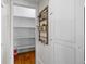 A look inside the well-organized walk-in pantry featuring wooden floors at 209 Windsor Green Ct, Canton, GA 30115