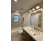 Beautiful bathroom featuring a tiled shower, modern vanity and updated fixtures at 3629 Stewart Rd, Atlanta, GA 30340