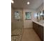Modern bathroom showcasing a glass-enclosed shower with mosaic floor and a double sink vanity with sleek design at 3629 Stewart Rd, Atlanta, GA 30340