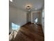 Bedroom featuring hardwood floors, a window and double doors at 3629 Stewart Rd, Atlanta, GA 30340
