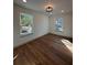 Bedroom featuring wood floors and plenty of natural light at 3629 Stewart Rd, Atlanta, GA 30340