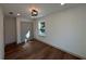 Bedroom featuring hardwood floors, a window and double doors at 3629 Stewart Rd, Atlanta, GA 30340