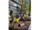 Charming landscaped front yard with a wood deck and colorful shrubbery at 3629 Stewart Rd, Atlanta, GA 30340