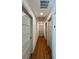 Hallway featuring hardwood floors, recessed lighting, and neutral paint at 3629 Stewart Rd, Atlanta, GA 30340