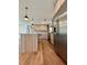 Bright, modern kitchen with wood-grain cabinets, stainless steel appliances, a tile backsplash, and an island with a sink at 3629 Stewart Rd, Atlanta, GA 30340