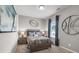 Bedroom featuring gray walls, sporty decor, and a coordinated color scheme at 525 Lanier Way, Temple, GA 30179